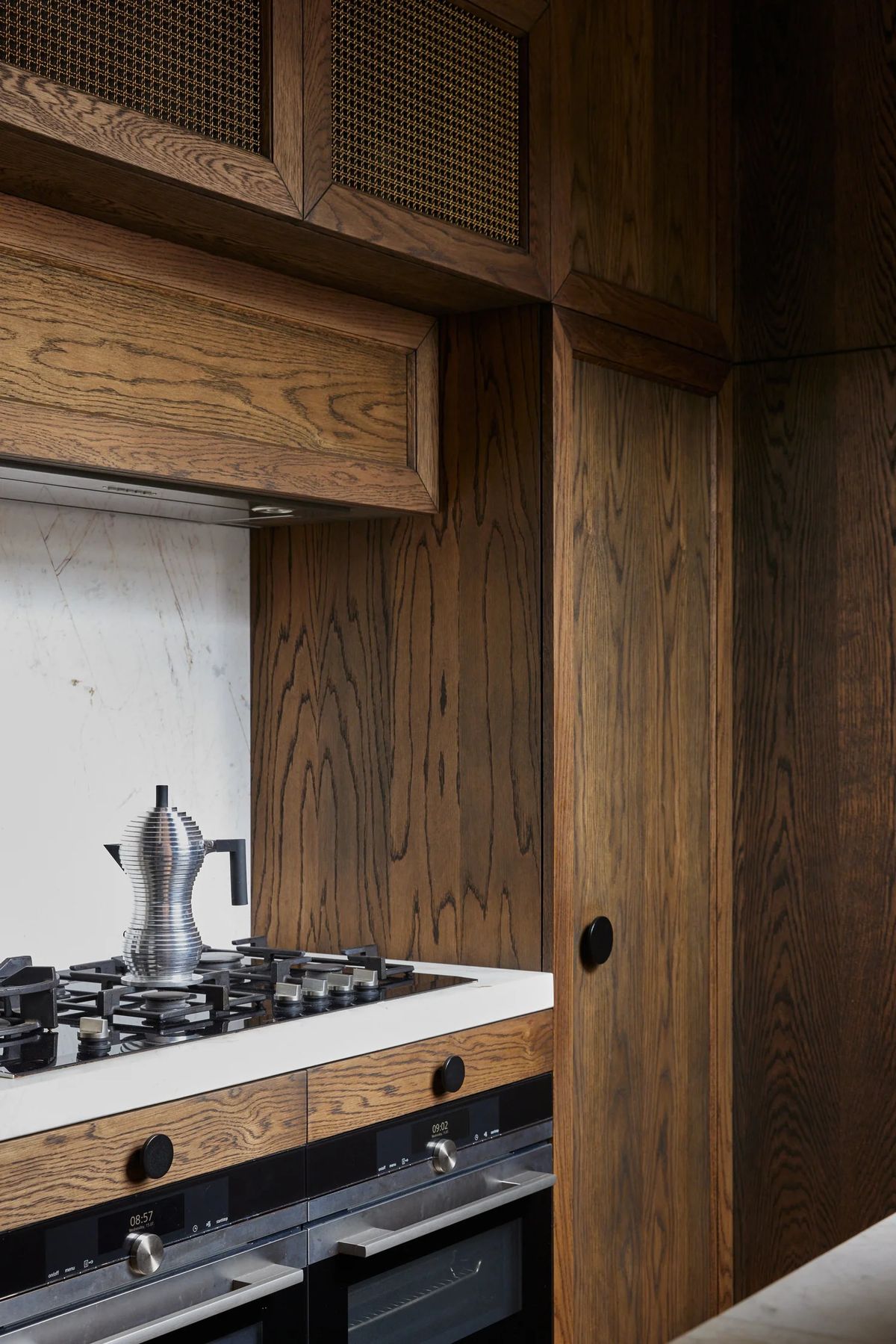 Timber rangehood over a stone benchtop