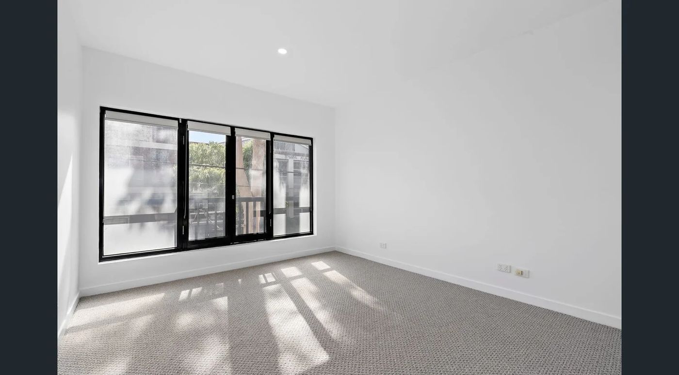 Freshly painted bedroom with new carpet, blinds and downlights