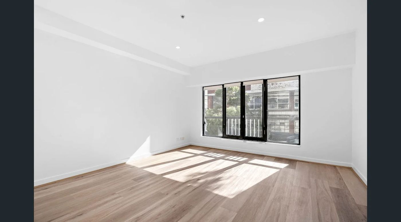 Living room with new hybrid flooring, fresh paint and downlights